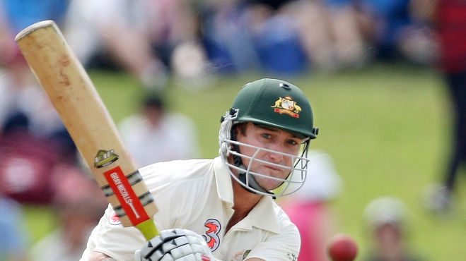 Phil Jaques sweeps a ball away