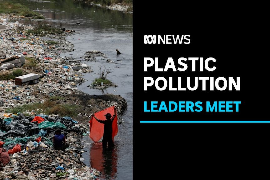 Plastic Pollution, Leaders Meet: A polluted waterway with rubbish along its banks. A man holds a plastic sheet in the shallows.