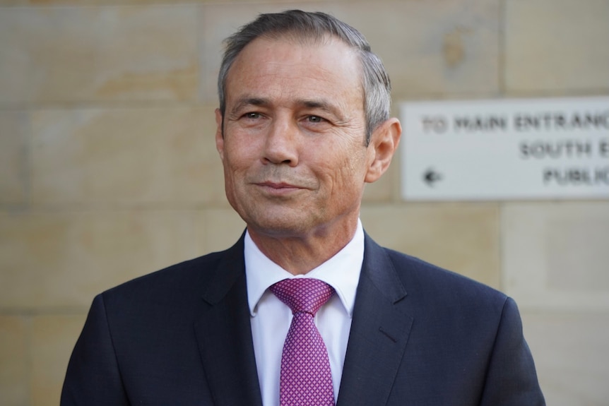 A head and shoulders shot of a smiling WA Health Minister Roger Cook.