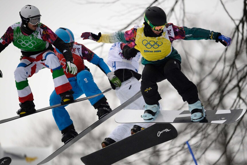 Cam Bolton leading his quarter-final in the snowboard cross