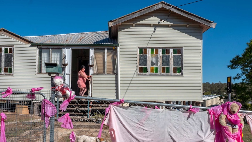 A Queenslander style house dressed up with pink ribbons.