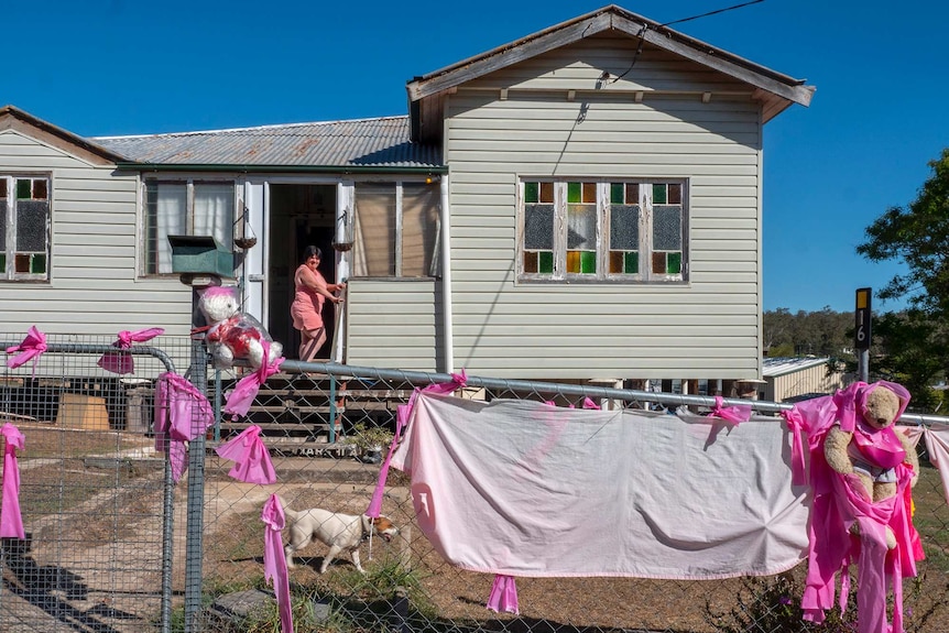 A Queenslander style house dressed up with pink ribbons.