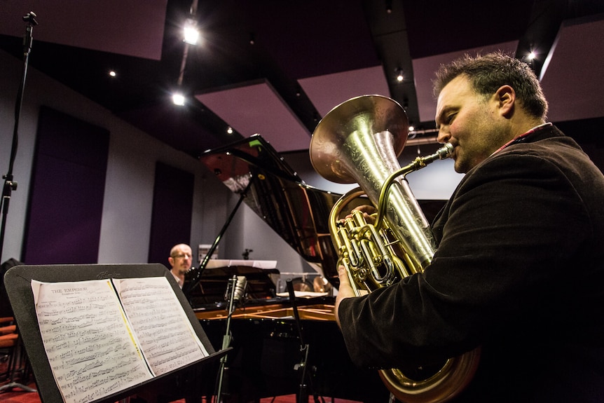 Euphonium performer, teacher and conductor Dr Matthew van Emmerik performing one of Percy Code's solos in a recording studio.