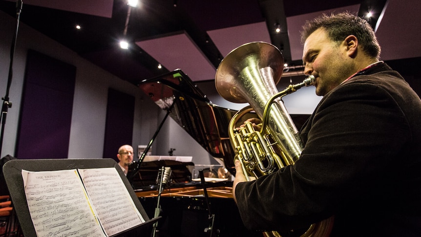 Euphonium performer, teacher and conductor Dr Matthew van Emmerik performing one of Percy Code's solos in a recording studio.