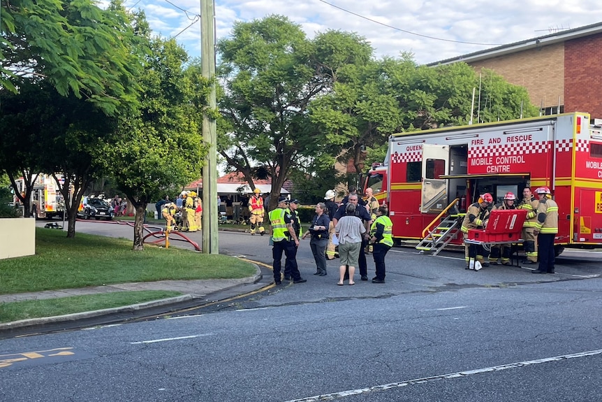 Fire crews on a suburban street.