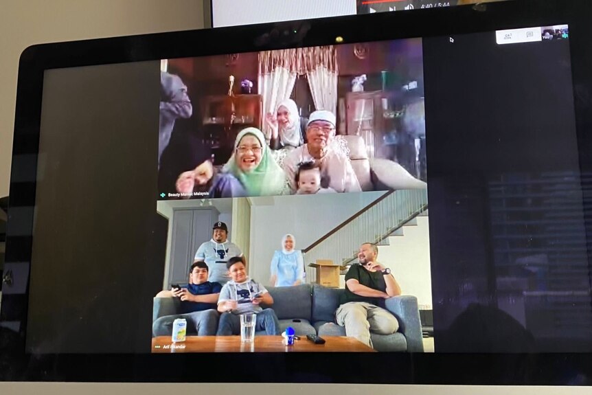 A computer screen shows a family Zoom call underway