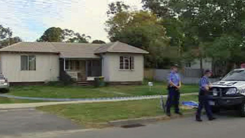 Police arrive at a house in Perth's south