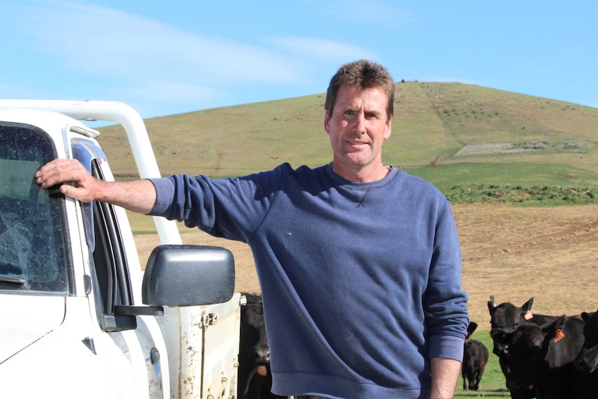 Farmer Brett Gleeson next to his ute,