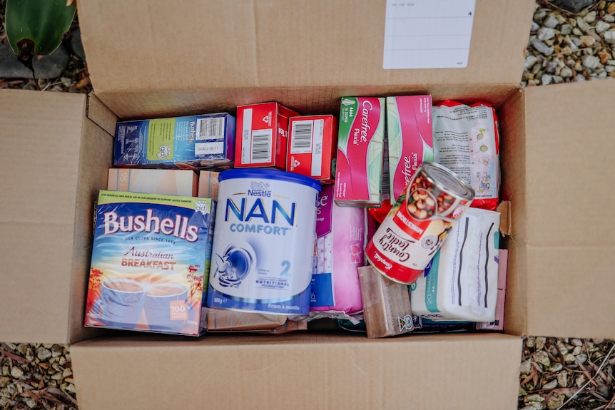tea, baby food and other essential goods in a box