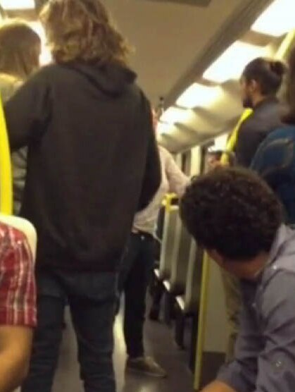 Video still of racist rant on Melbourne train