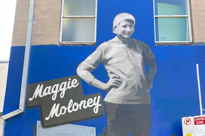 A mural of a female football player
