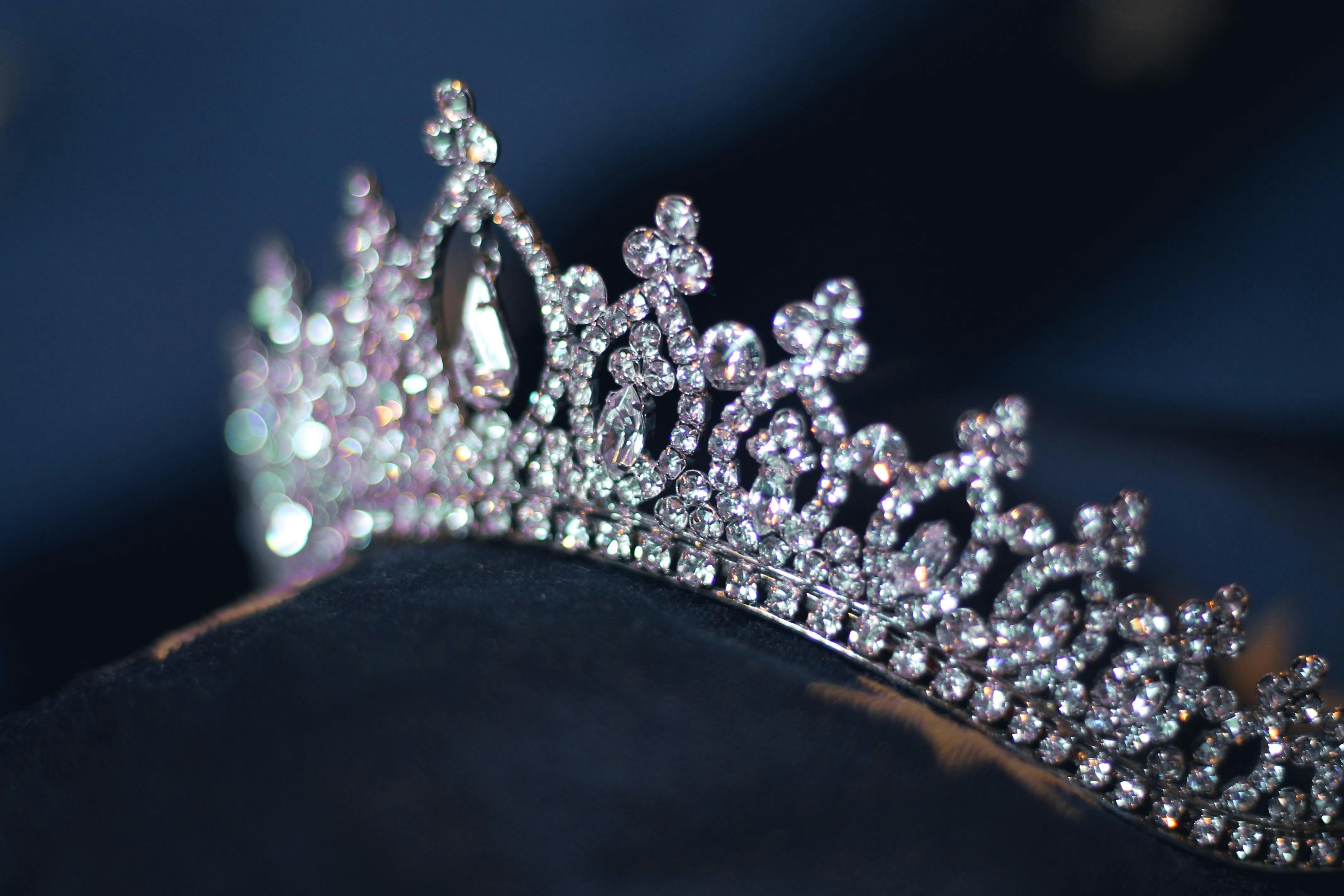 diamante tiara resting on a dark surface