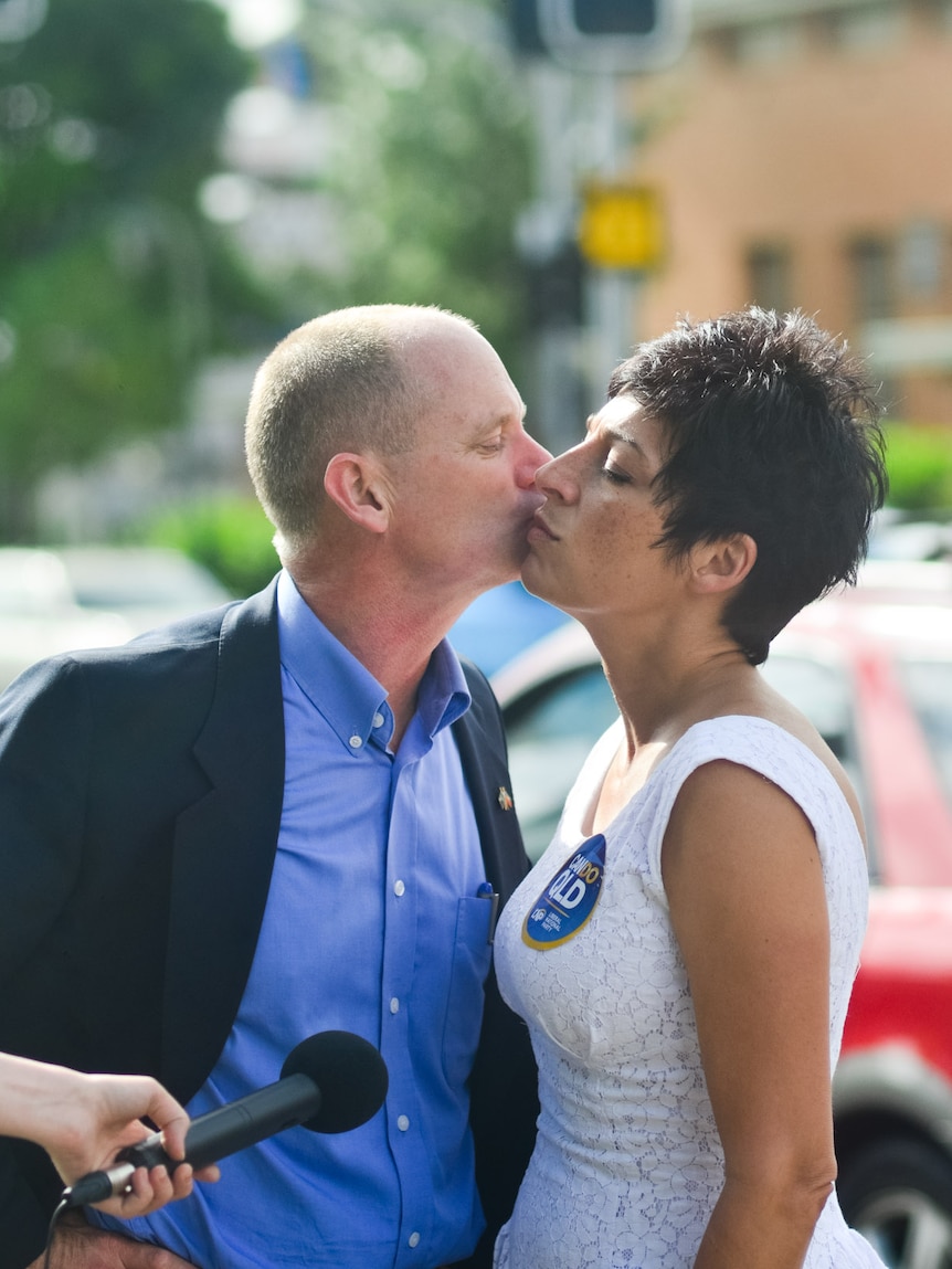 Campbell Newman kisses his wife Lisa, as she campaigns in Ashgrove.
