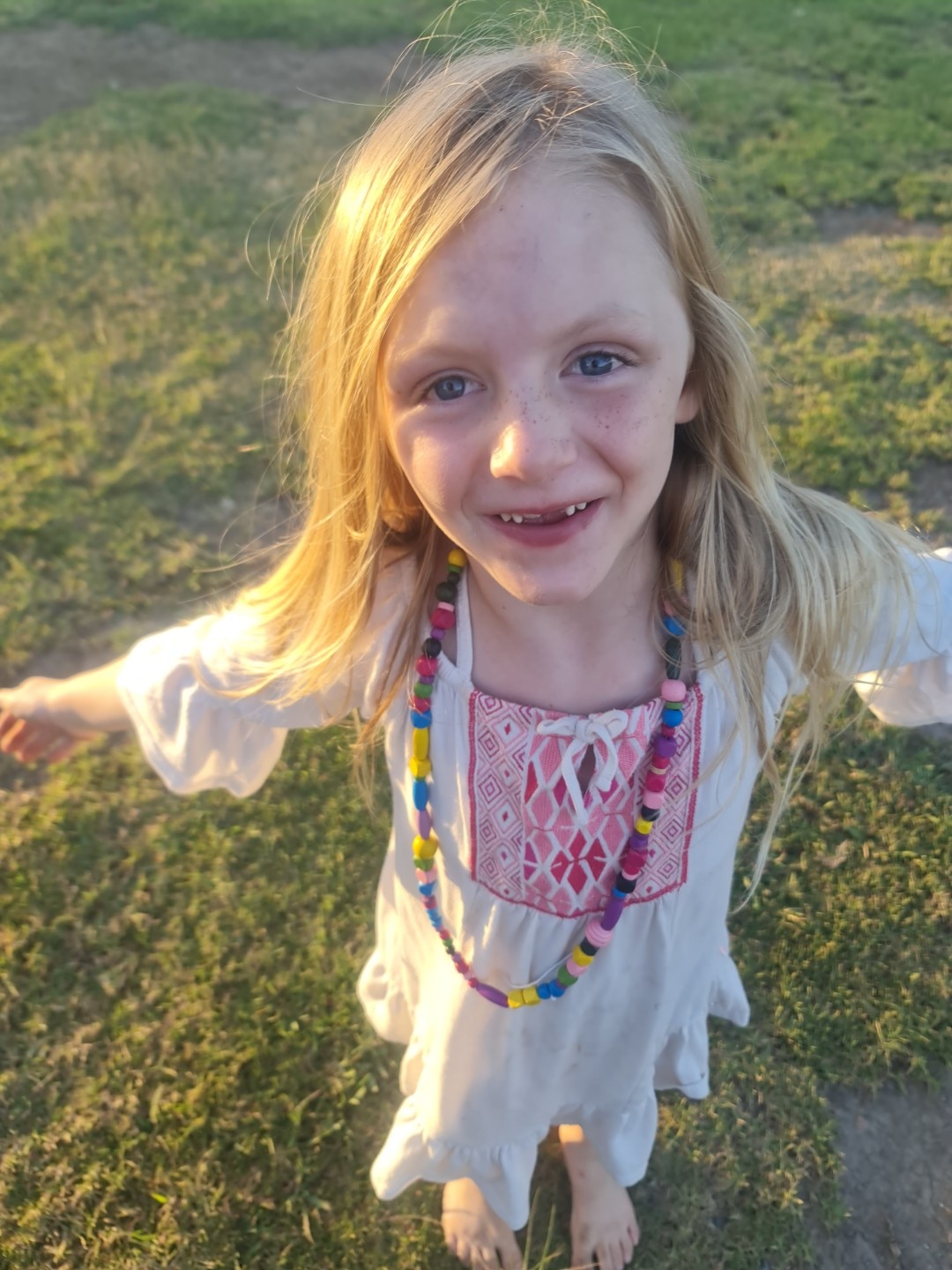 A close up photo of a young girl smiling