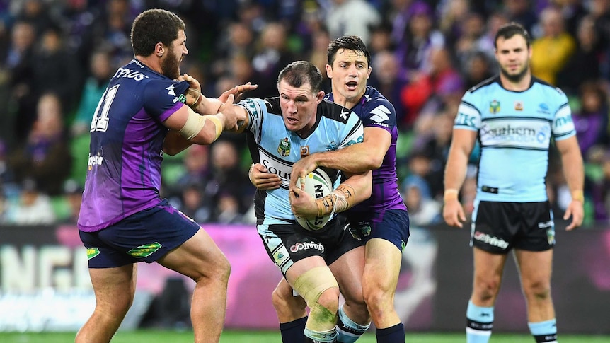 Cronulla's Paul Gallen is tackled against Melbourne at AAMI Park