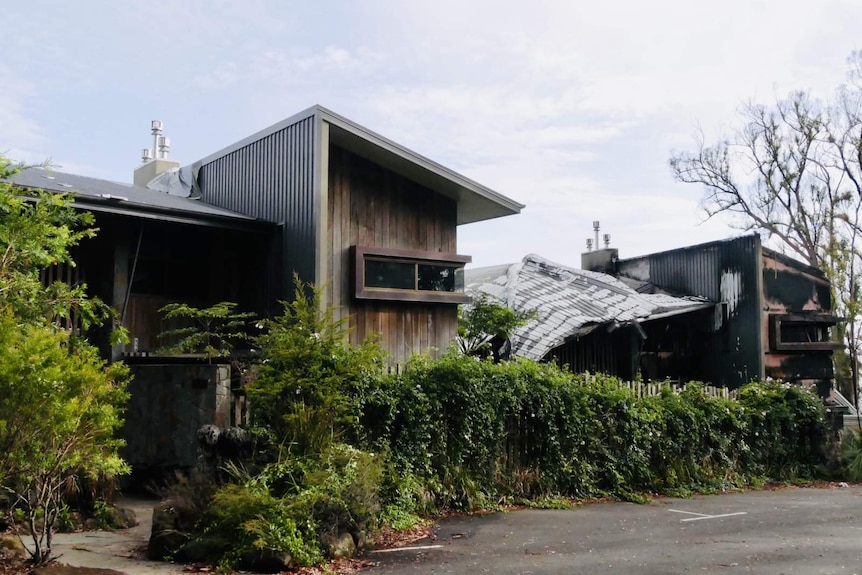 A row of burnt-out buildings.