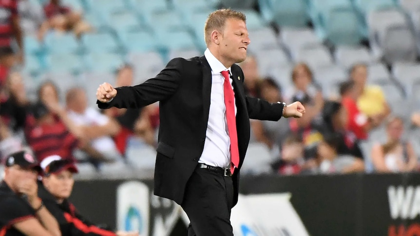 Wanderers' head coach Josep Gombau celebrates on the sideline.