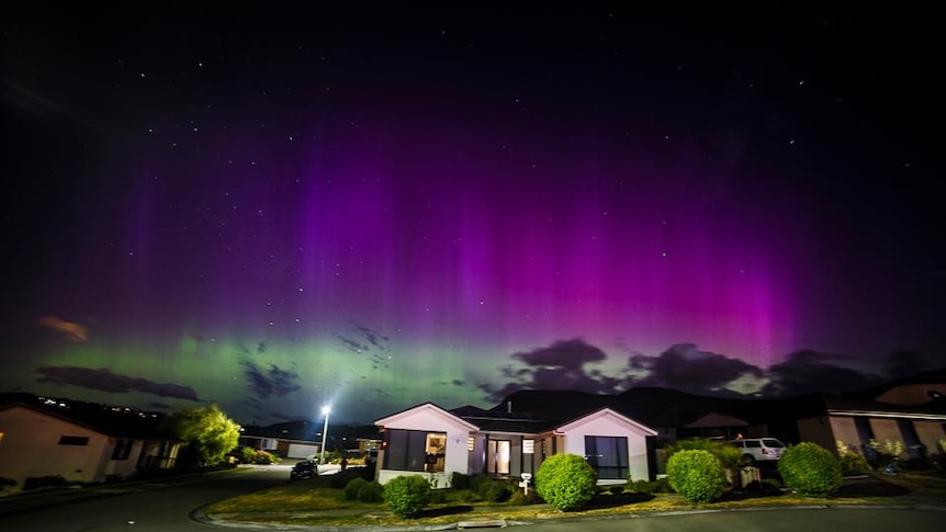 The aurora australis shining bright over Glenorchy in Hobart.