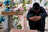 A relative of murdered sisters Griseida and Karen Barraza, cries in the cemetery in Ciudad Juarez