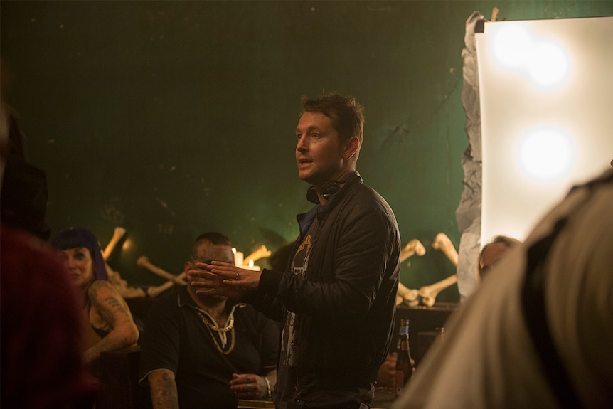 Colour photograph of Upgrade director Leigh Whannell speaking to cast members during a scene in 2018 film Upgrade.