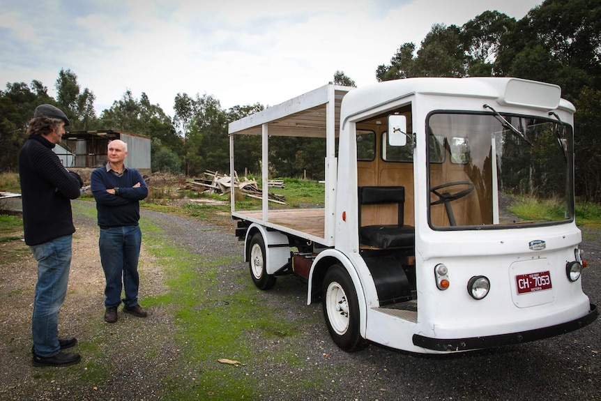 The 1960s British electric milk cart is run on batteries powered by solar panels on the roof.