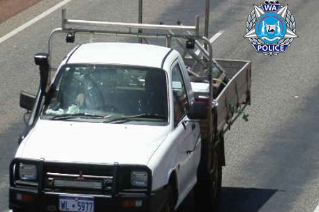 A CCTV image of a white Mitsubishi ute.