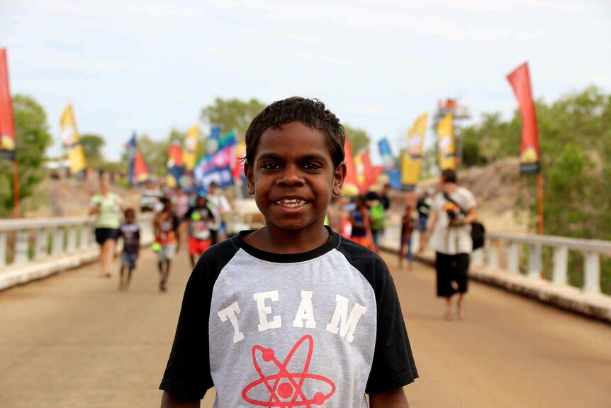 Young boy joins 50th anniversary re-enactment of the Wave Hill walk-off at Kalkarindji.