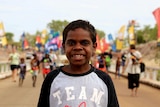 Young boy joins 50th anniversary re-enactment of the Wave Hill walk-off at Kalkarindji.