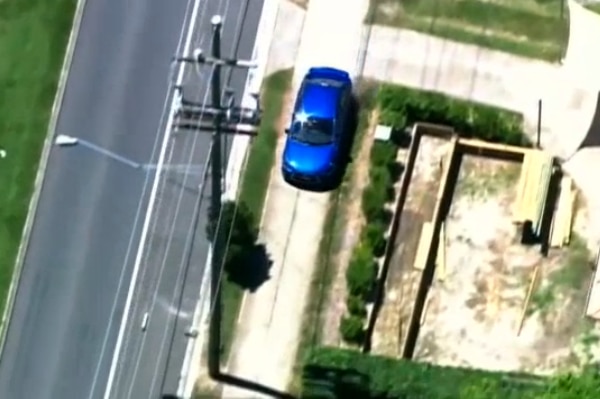 The car mounts the footpath in the streets of Deception Bay, north of Brisbane