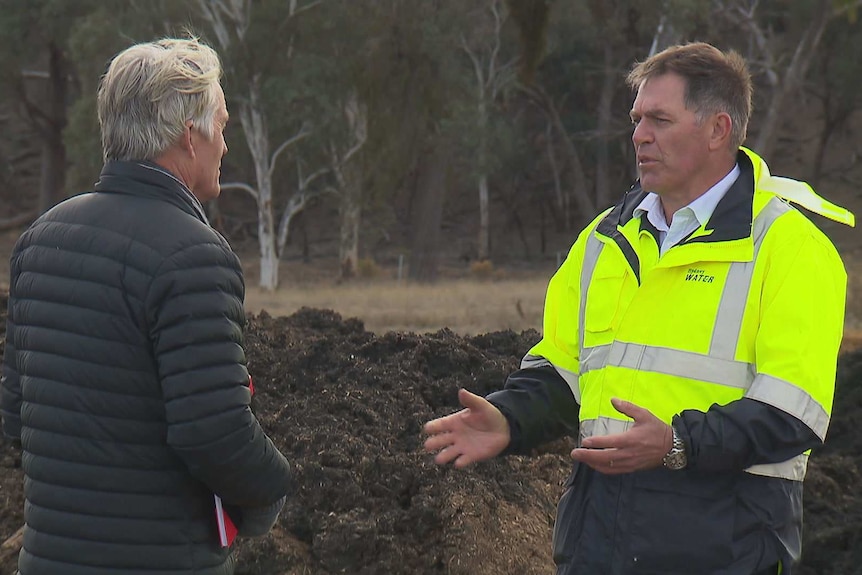 Two men talking about the benefits of biosolids