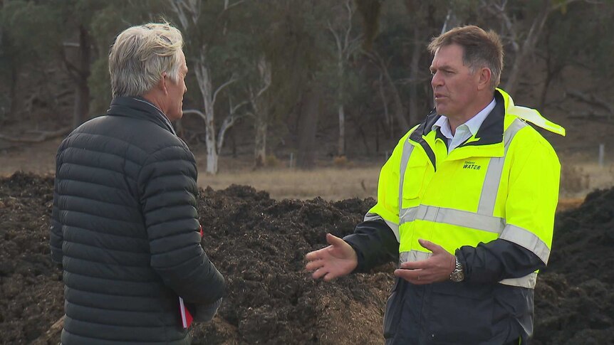 Two men talking about the benefits of biosolids