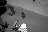 Three bite marks left in the Martian ground by the scoop on the robotic arm of Mars rover Curiosity