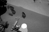 Three bite marks left in the Martian ground by the scoop on the robotic arm of Mars rover Curiosity
