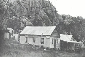 Black and white photo of a weatherboard pub.