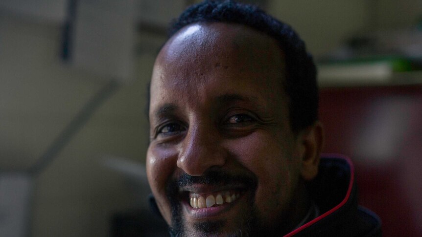 Hamdi Ali smiles at the camera