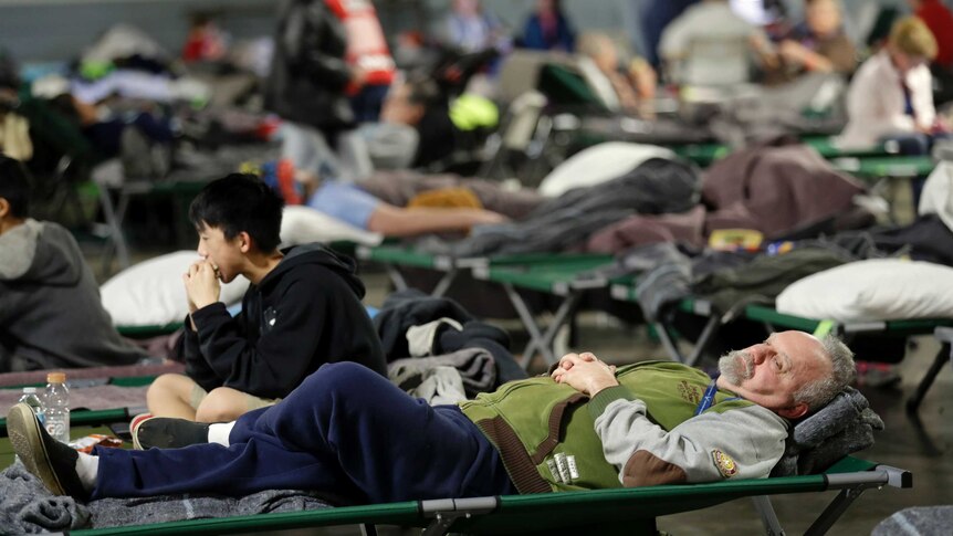 Evacuees rest in a shelter near the Oroville Dam