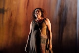 Image of actress Ningali Lawford-Wolf performing on stage at the Edinburgh International Festival.