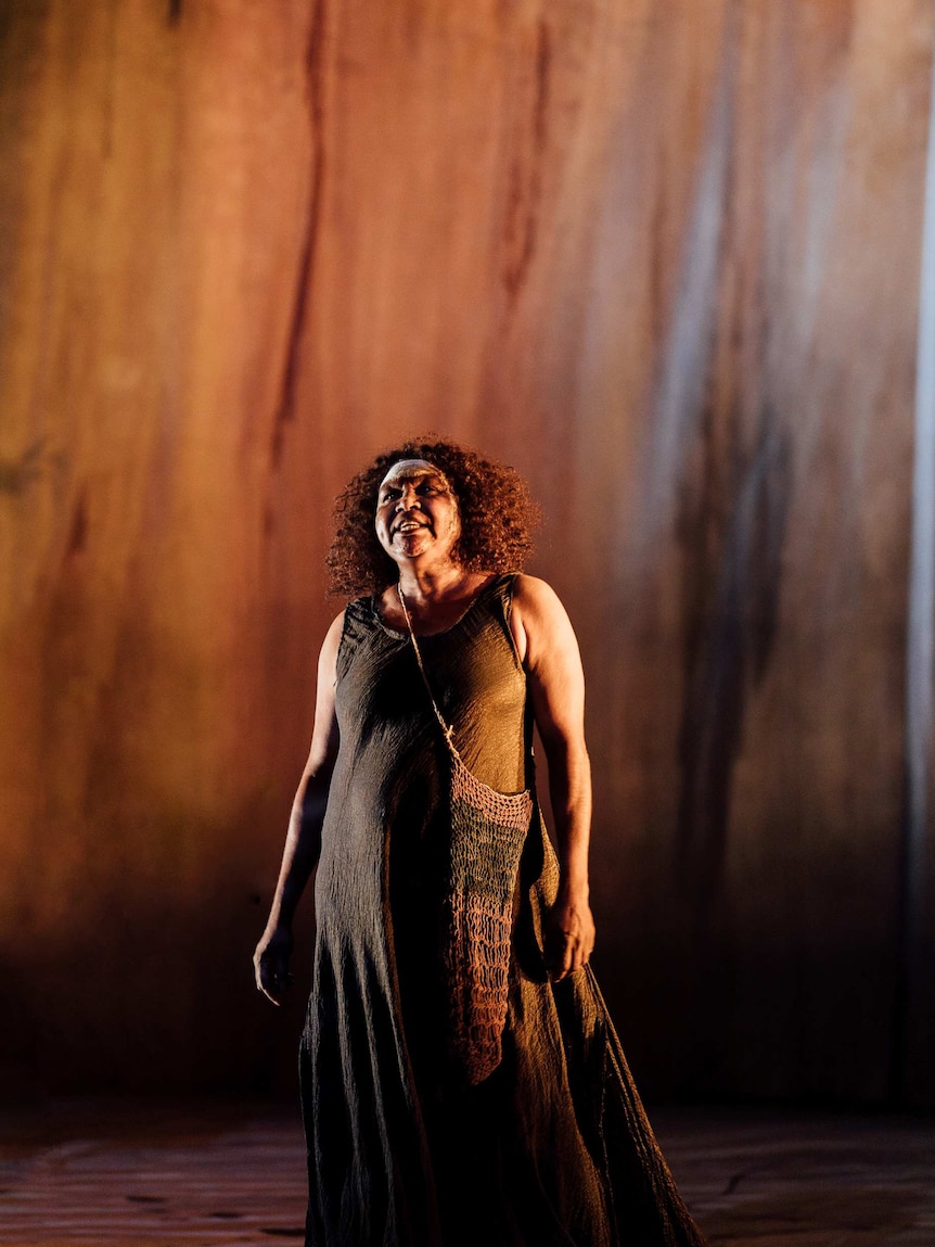 Image of actress Ningali Lawford-Wolf performing on stage at the Edinburgh International Festival.