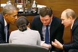 US president Barack Obama talks with Russian president Vladimir Putin at the G20 summit.