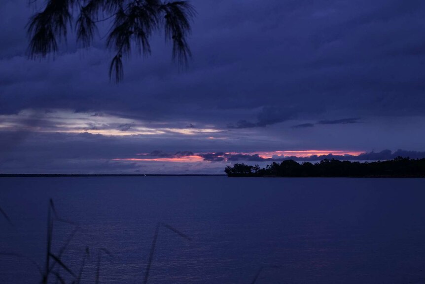 A photo of a purple sunset over Darwin Harbour.