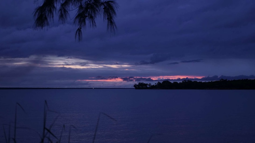A photo of a purple sunset over Darwin Harbour.