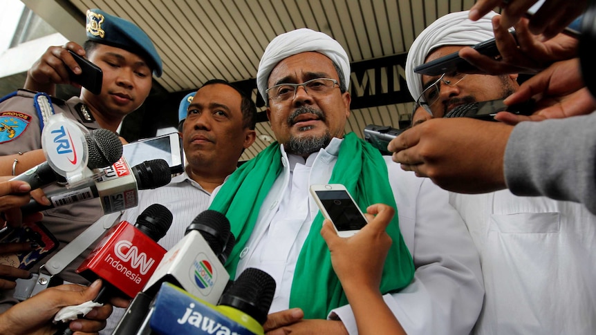 Indonesia Election Preview: Habib Rizieq, the spiritual leader of the Islamic Defenders Front, speaks to reporters