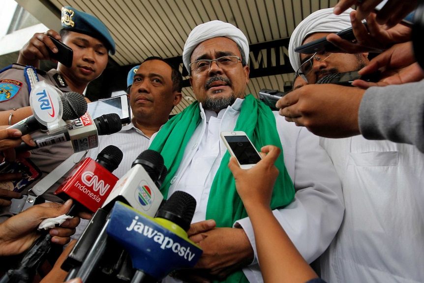 Indonesia Election Preview: Habib Rizieq, the spiritual leader of the Islamic Defenders Front, speaks to reporters