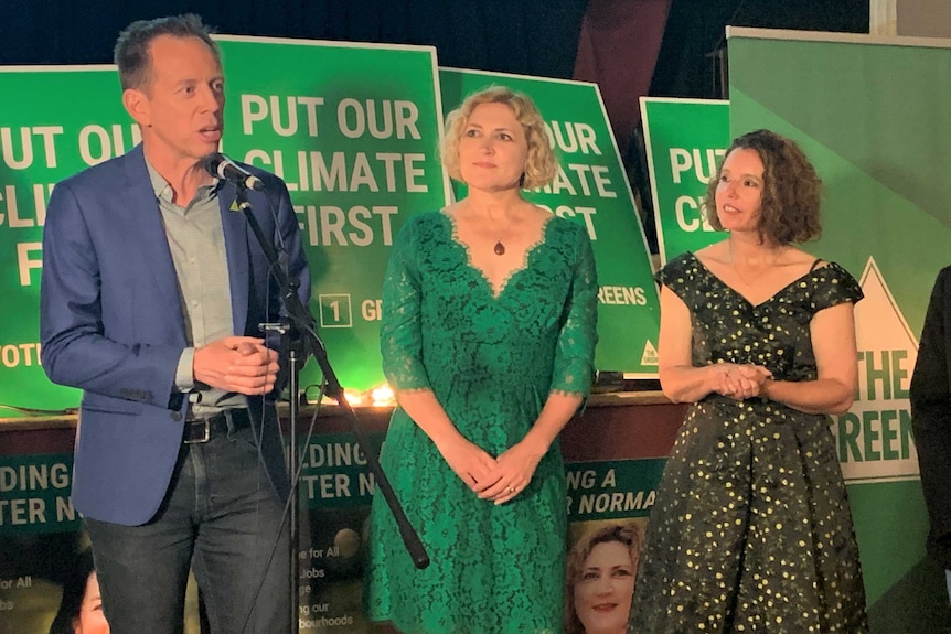 Shane Rattenbury with two women — Emma Davidson and Rebecca Vassarotti — at the ACT Greens election party.