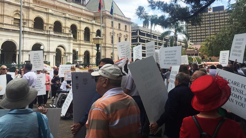 About 200 cab drivers and their supporters rallied outside State Parliament