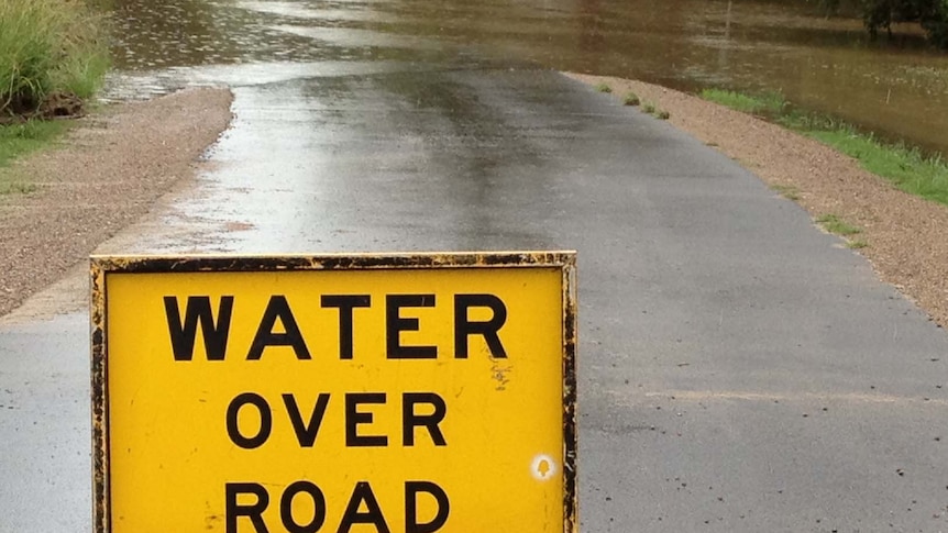 Floodwaters rise on a road in Pamona