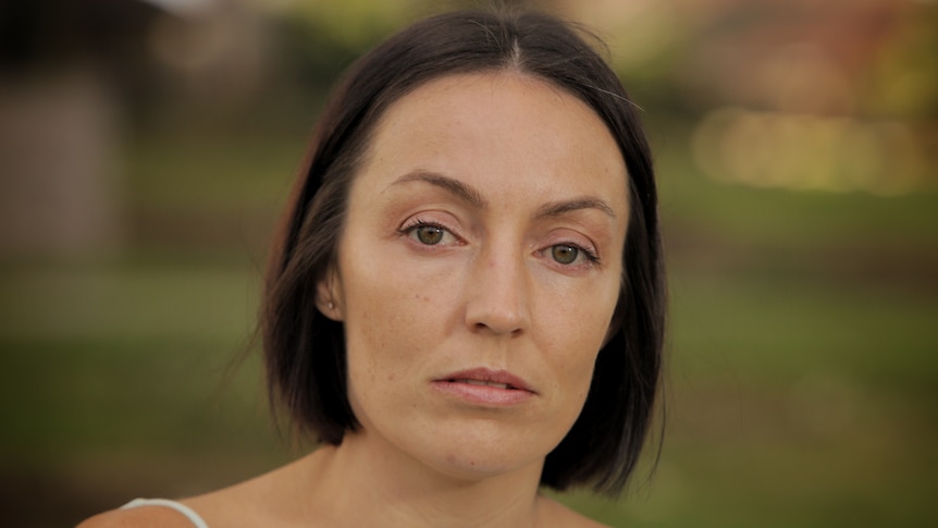 A woman with brown hair.