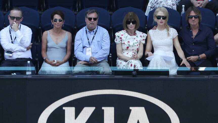 Alan Joyce Jayne Hrdlicka, a man, Anna Wintour, Nicole Kidman and Keith Urban sit in grandstands.