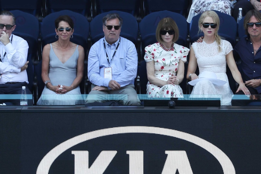 Alan Joyce Jayne Hrdlicka, a man, Anna Wintour, Nicole Kidman and Keith Urban sit in grandstands.