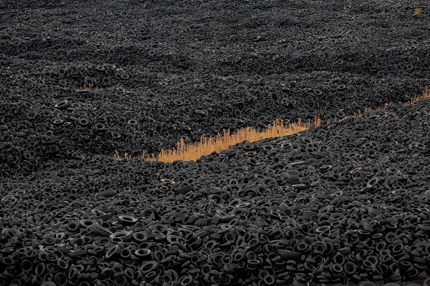 Mountains of used tyres lie on a dump in the countryside in Sesena Nuevo, near Madrid, Spain.